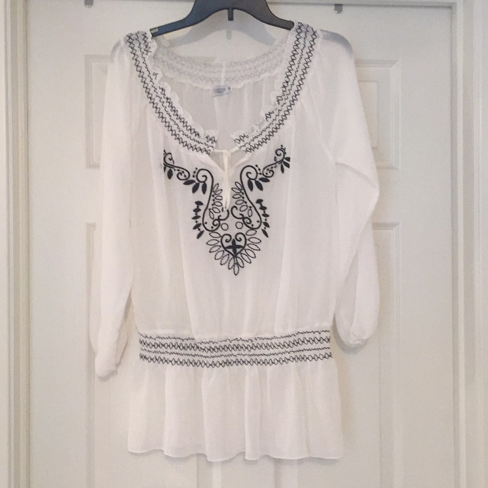 White and black blouse.